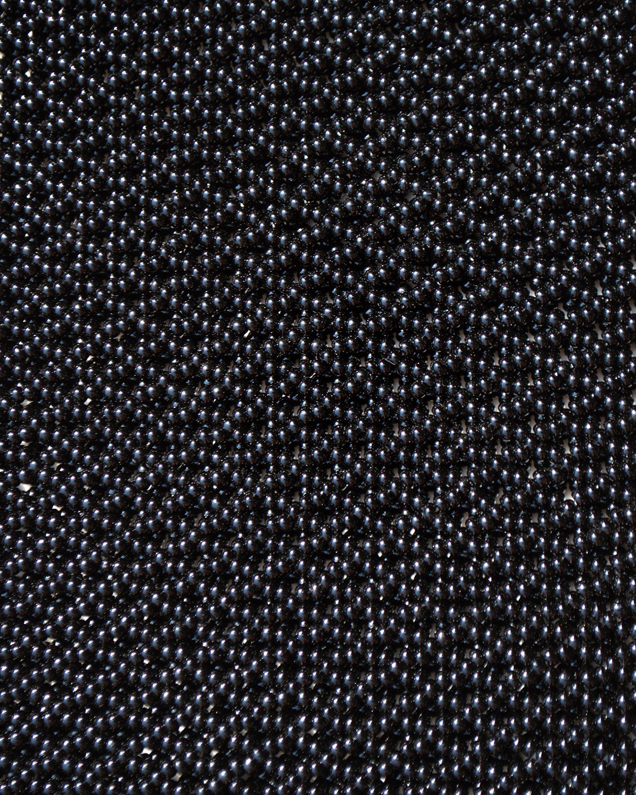 closeup picture of black beads as they are in all Marmaclub Fringe black bags