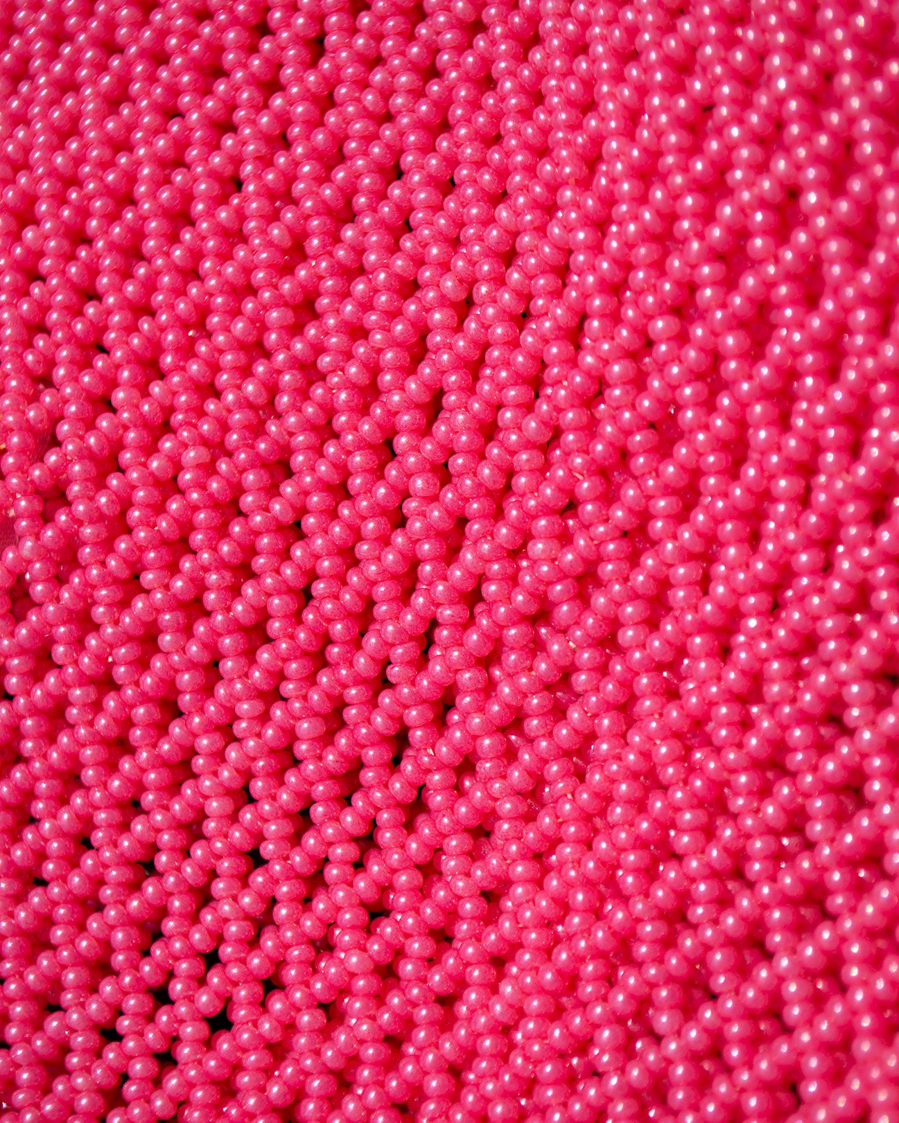 closeup picture of pink beads as they are in all Marmaclub Fringe Hot Pink bags